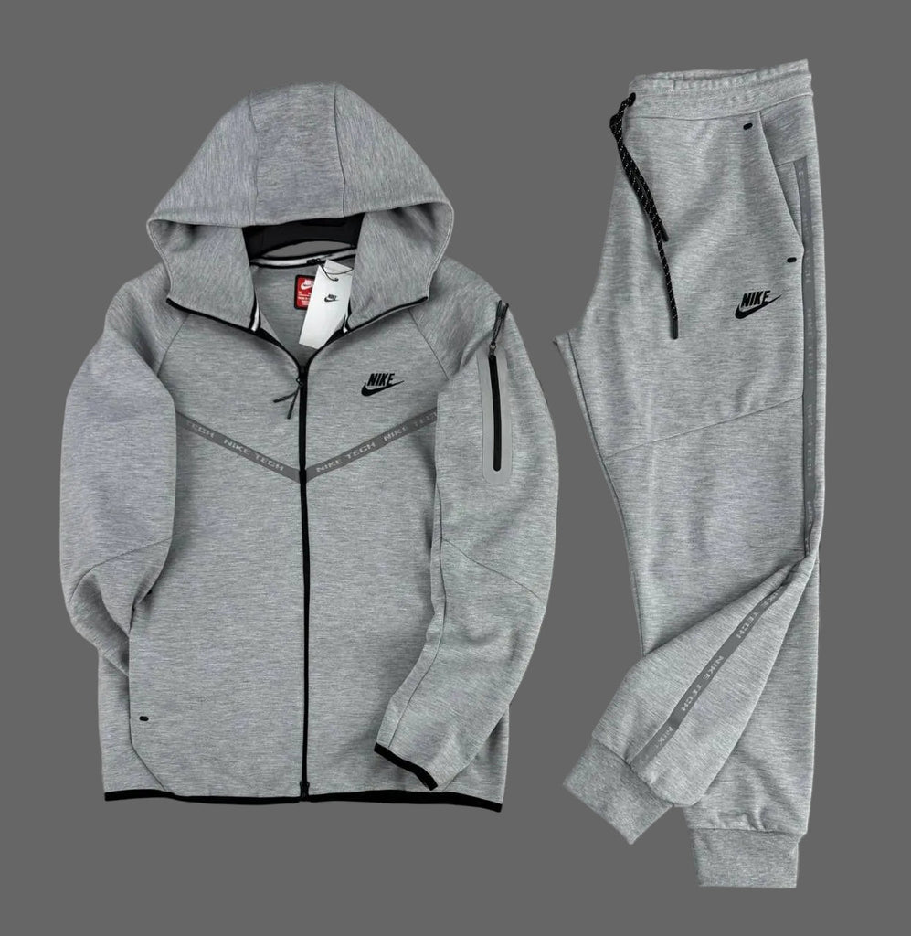 pánska tepláková súprava Nike Tech Fleece, klasická sivá, z odsevnimi pásikovi a vreckom na rukáve